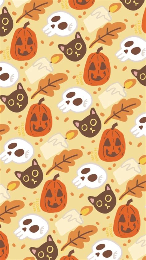 An Orange And Brown Halloween Pattern With Cats Pumpkins And Skulls On It