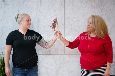 Human Rights LGBT Stock Photo Lesbian Couple With Rainbow Ribbon Flag Body Liberation