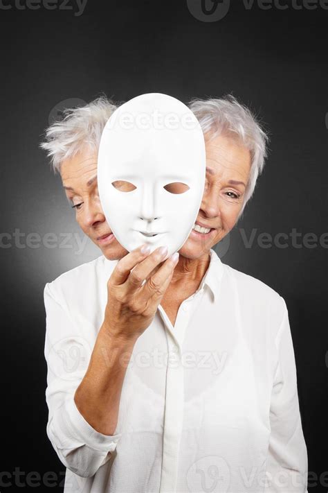 Older Woman Hiding Happy And Sad Face Behind Mask 6240503 Stock Photo