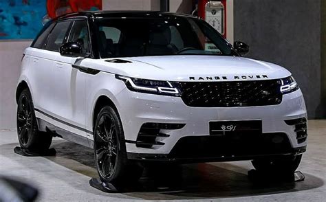 white range rover  parked  front   wall   advertisement