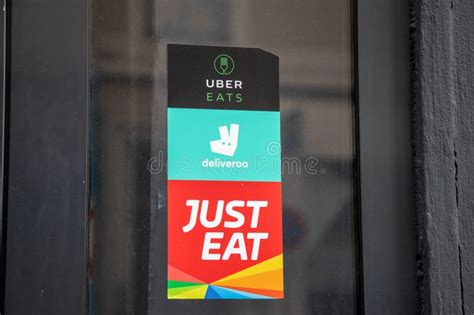 Deliveroo Just Eat Uber Eats Sign Brand And Sticker Text Logo On Door