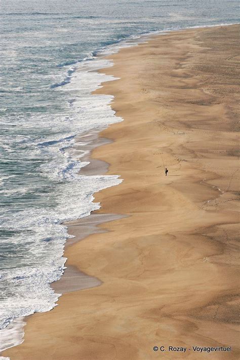 The fisherman alone on the vast beach north of Nazaré - Portugal