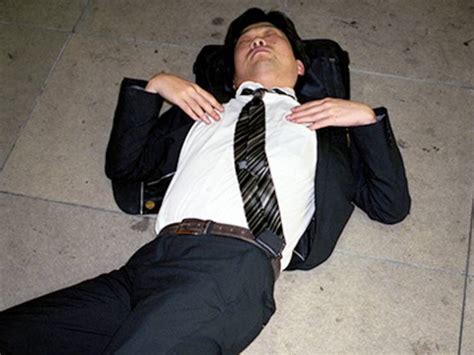 Japanese Businessmen Sleeping On The Streets Are A Testament To Japans