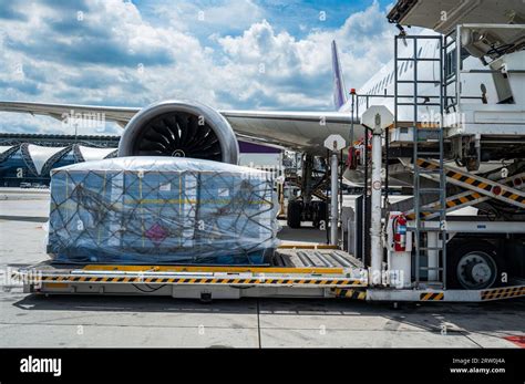 Air Cargo Logistic Containers Are Loading To An Airplane Air Transport