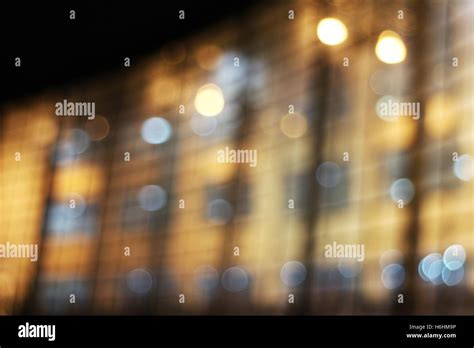 Defocused glass building facade at night Stock Photo - Alamy