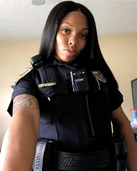 Female Police Officer Poses With Confidence