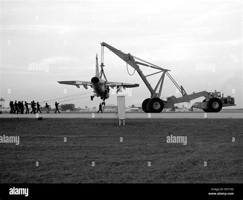 A Us Navy Aircraft Crane Is Used To Hoist An Ltv A 7e Corsair Ii