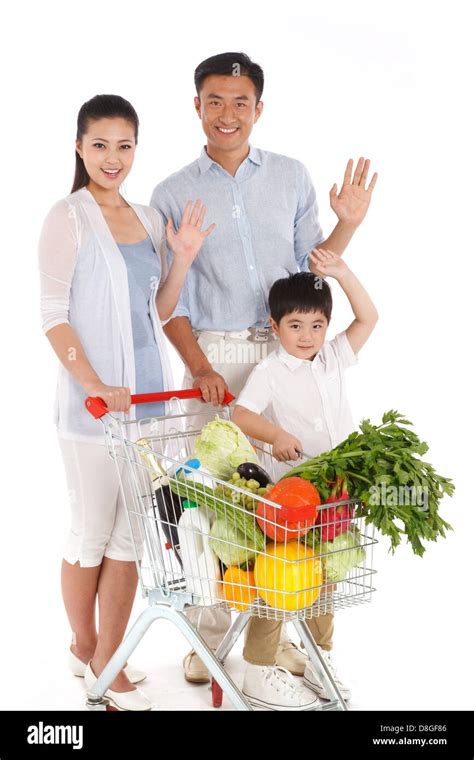 Family shopping with shopping cart Stock Photo - Alamy