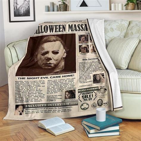 A Halloween Movie Themed Throw Blanket Sitting On Top Of A Wooden Floor