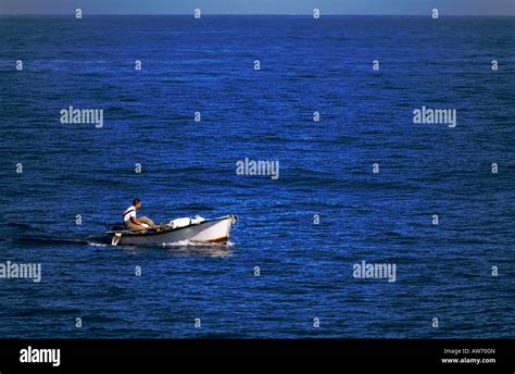 Fishing boat in the ocean Stock Photo - Alamy