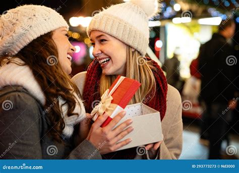 Portrait Of Happy Women Exchanging Christmas Presents Holiday People