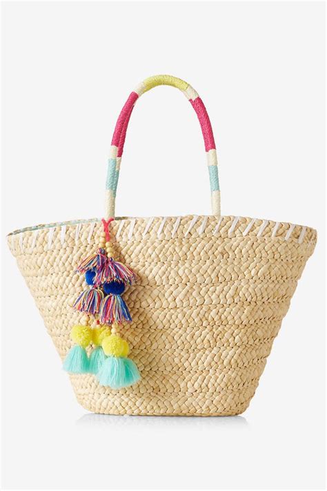 10 Straw Beach Bags To Tote On Your Spring Break Getaway Straw Beach Bag Summer Accessories