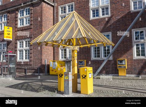 Yellow Mailboxes From The German Postal Service In The City Of Bremen