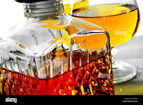 Closeup Of A Vintage Glass Liquor Bottle And Some Cognac Glasses With