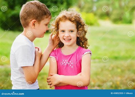 The Little Boy Whispers A Secret On An Ear Stock Image Image Of Mystery Listening 43852355