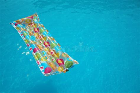 Colorful Inflatable Mattress Floating In Swimming Pool On Sunny Day ...