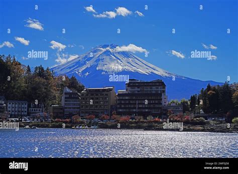 Day View Of The Snow Capped Mount Fuji In The Fall In Lake Kawaguchi