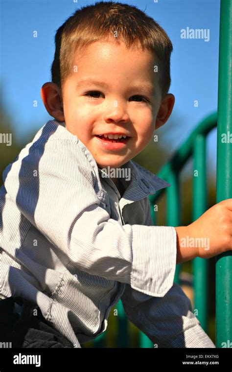 A Cute 3 Year Old Boy Playing At The Playground Stock Photo Alamy