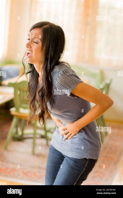 Woman has abdominal pain Stock Photo - Alamy