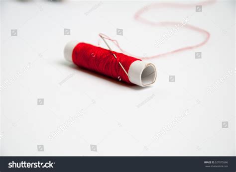 needle red thread isolated stock photo  shutterstock