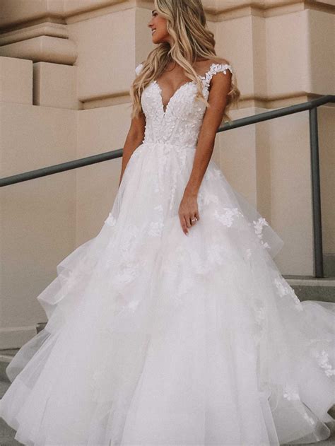 23 Ruffle Wedding Dresses That Channel A Romantic Vibe