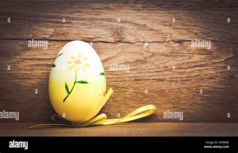 Easter Eggs And Pussy Willow On Rustic Wooden Background Stock Photo