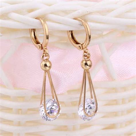 Прозрачные серьги с фианитом и напылением из жёлтого золотаМагазин ...