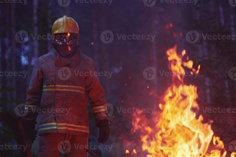 Firefighter in action 11589833 Stock Photo at Vecteezy