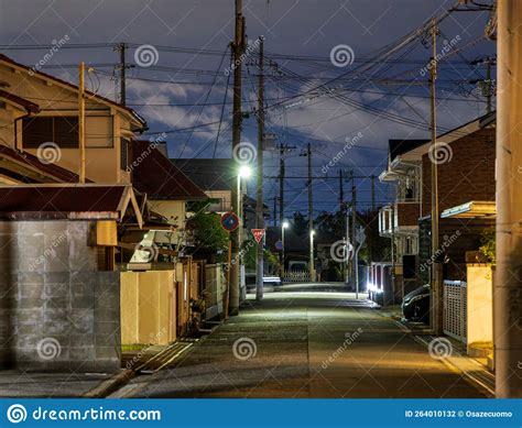 Empty Street Through Quiet Japanese Neighborhood At Night Editorial