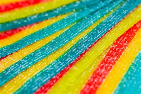 Background Of Rainbow Sour Jelly Candies Strips In Sugar Sprinkle Top