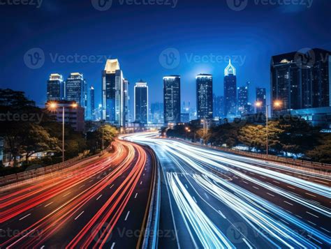 The light trails on the modern building background. Rainy city street