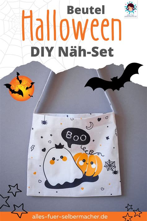 An Image Of A Halloween Bag Hanging On The Wall With Bats And Spider Webs