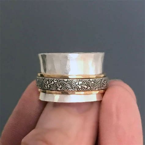 Hammered Silver Spinner Ring With Gold And Silver Textured Bands Mixed