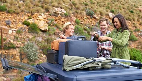 Premium Photo | Friends group and luggage on car roof for road trip ...