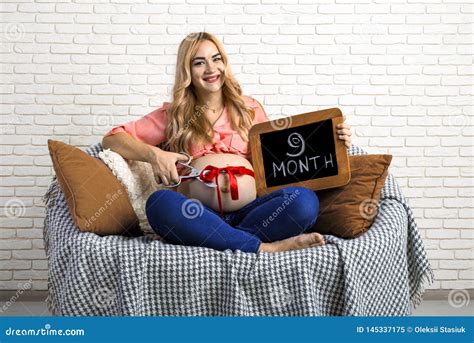 Pregnant Girl With A Sign And A Ribbon On The Belly Big Belly Ninth Month Obraz Stock Obraz