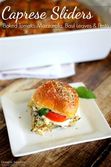 Caprese Sliders With Baked Tomato Mozzarella Basil Leaves And Pesto