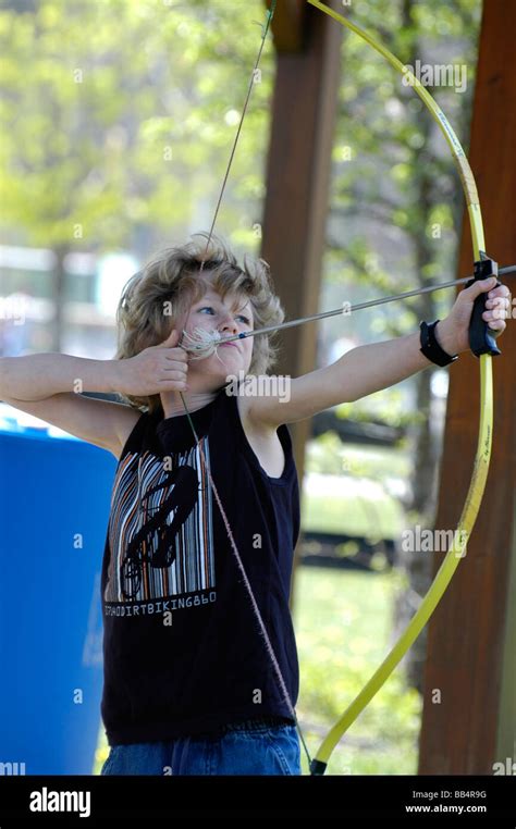 A Young Boy Practices Archery Stock Photo Alamy