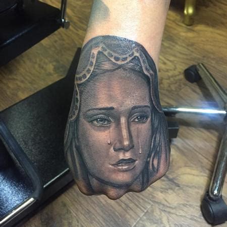 Virgin Mary Hand By Ricky Clipz TattooNOW