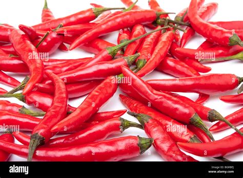 A Group Of Red Hot Chilli Peppers Over White Background Texture Stock Photo Alamy