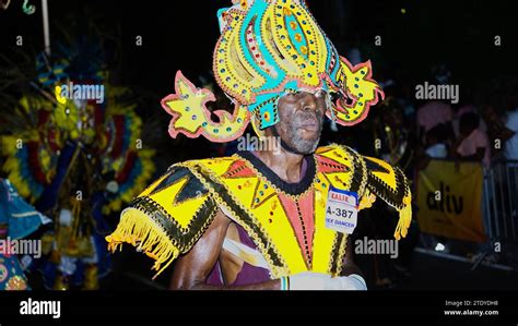 People Celebrating In Colorful Costumes And Dancing To Music At The