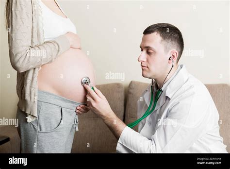 Doctor Is Checking Pregnant Woman S Belly With A Stethoscope Physician