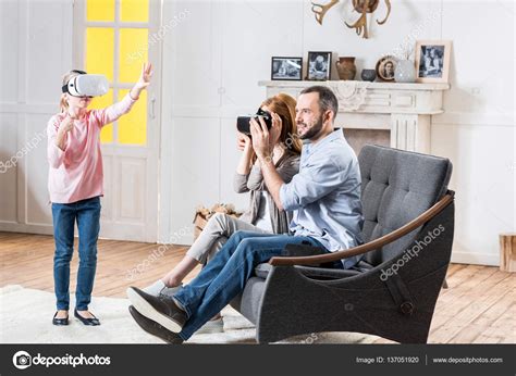 Family in virtual reality headsets — Stock Photo © TarasMalyarevich #137051920