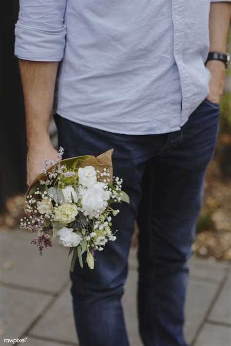 Man Holding A Beautiful Bouquet Of Flowers