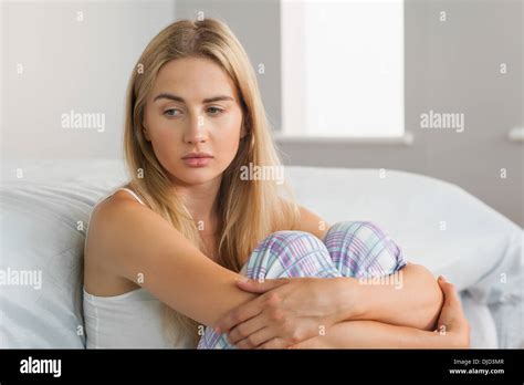 Lonely Blonde Sitting On The Floor Stock Photo Alamy
