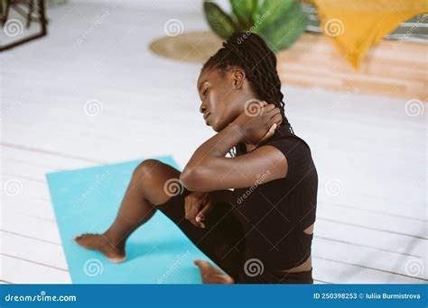 Dark Skin Multiracial Woman With Dreadlocks Stretching Doing Yoga