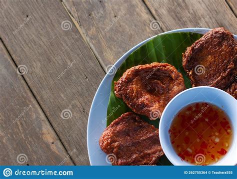 Fried Fish Paste Balls Or Deep Fried Fish Cake On Wood Table Close Up