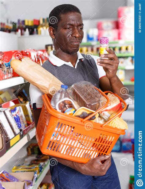 Ordinary Mature African Man Holding Spice Packs Stock Image Image Of