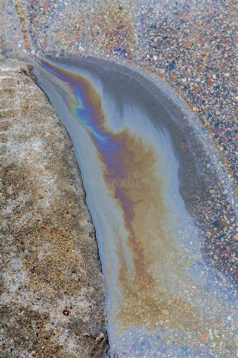 Spill Of Oil Spilled On Asphalt Stock Image Image Of Slick Water