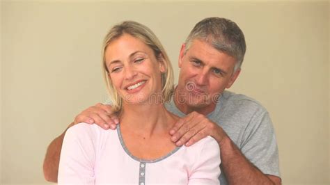 Husband Massaging Back Of Pregnant Wife During Contractions Stock