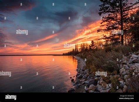 Sunset Over Clear Lake In Riding Mountain National Park Hi Res Stock